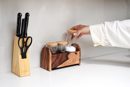 Wooden kitchen organizer with jars to organise salt and spices 
