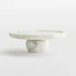 Marble-patterned marble cake stand   on a white background